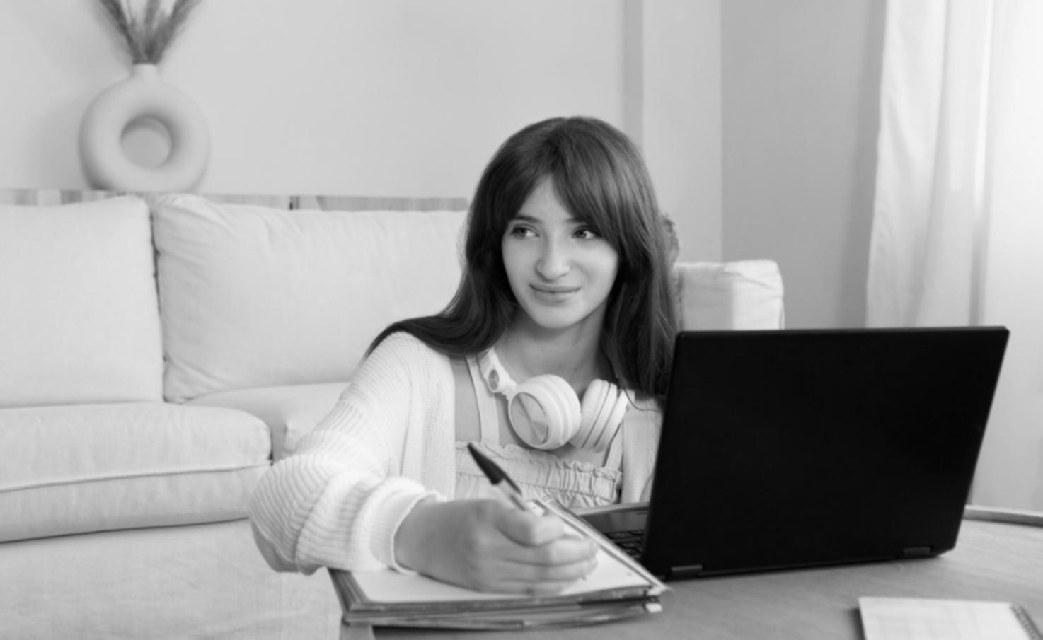 Financial documents spread across desk with coffee mug